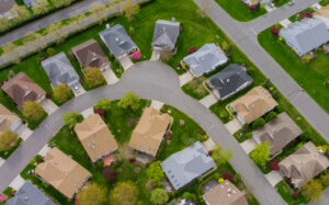 Aerial view of a clean suburban cul-de-sac in Columbus, Ohio, featuring well-maintained houses and green lawns.